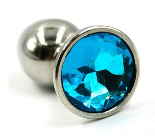 Серебристая анальная пробка с нежно-голубым кристаллом - 7 см.