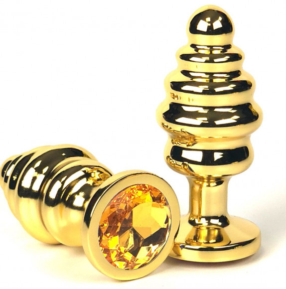 Золотистая ребристая анальная пробка с оранжевым кристаллом - 8,5 см. Золотистая ребристая анальная пробка с оранжевым кристаллом - 8,5 см.