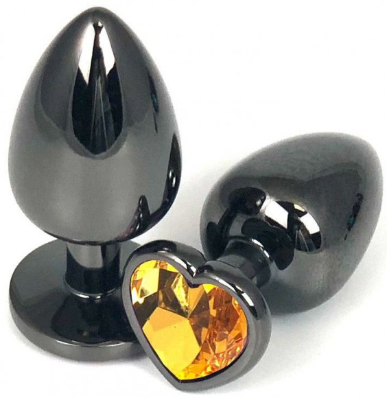Черная анальная пробка с оранжевым стразом-сердечком - 6,5 см. Черная анальная пробка с оранжевым стразом-сердечком - 6,5 см.